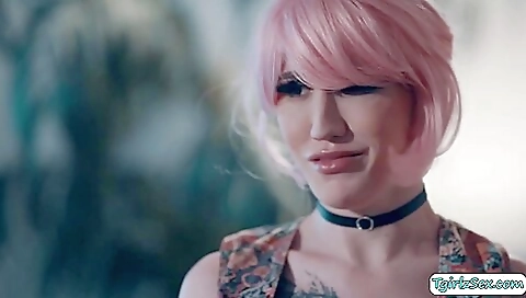 Tattooed redhead with a pretty body is fucking herself